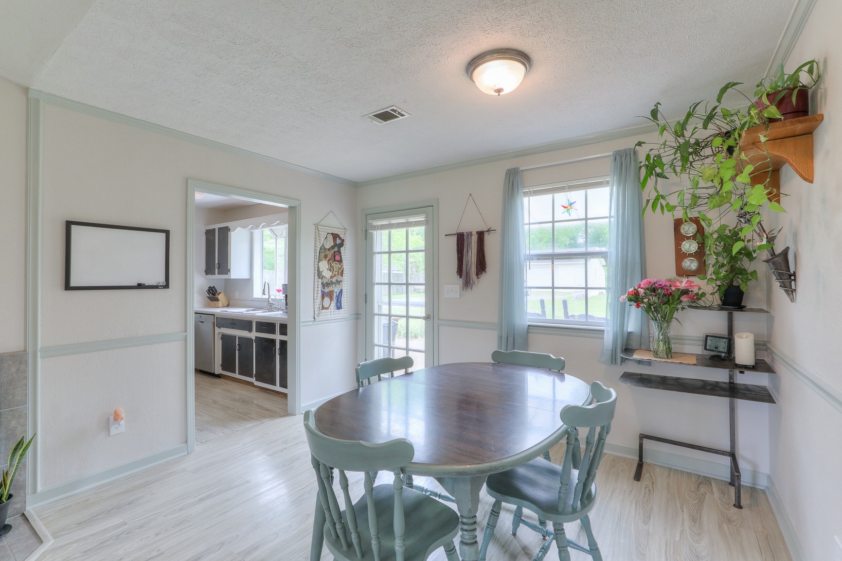 1488 Phillips Road Lebanon, TN 37087 - Photo 8 of 34 a view of a a dining room with furniture window and wooden floor