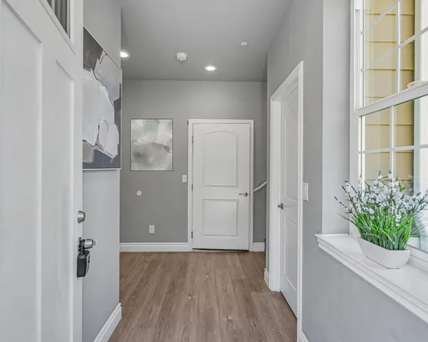 a view of entryway with wooden floor