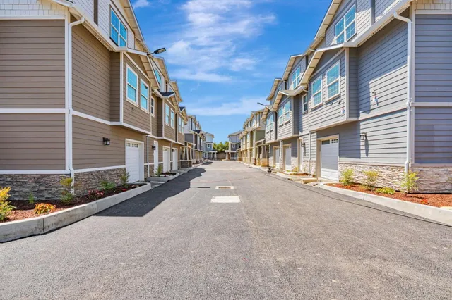 a view of a street with a building