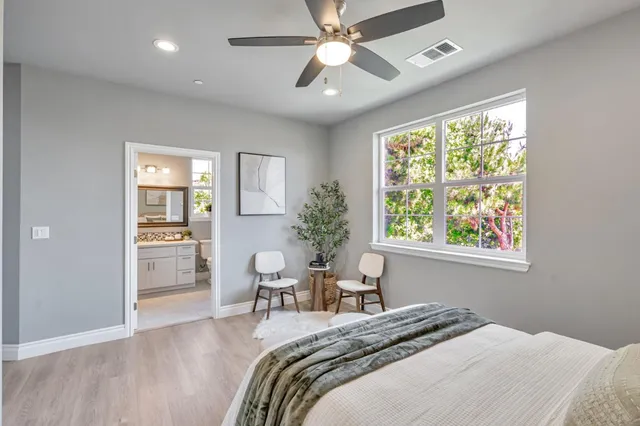 a bedroom with a bed and a chair