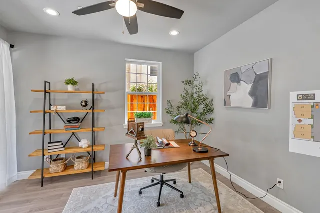 a view of a livingroom with furniture and a window