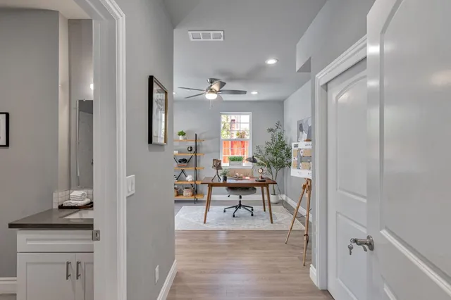 a view of a livingroom with furniture and wooden floor