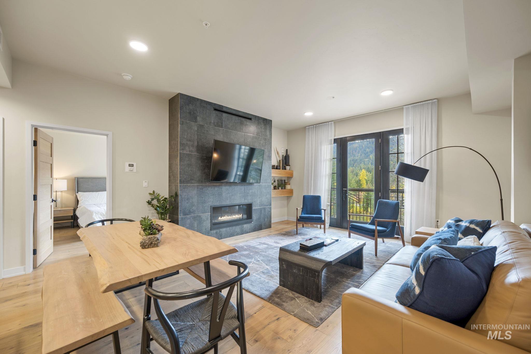 780 Village Drive, Unit 505 Donnelly, ID 83615 - Photo 4 of 33 Living room with a tile fireplace, light wood-style floors, and recessed lighting