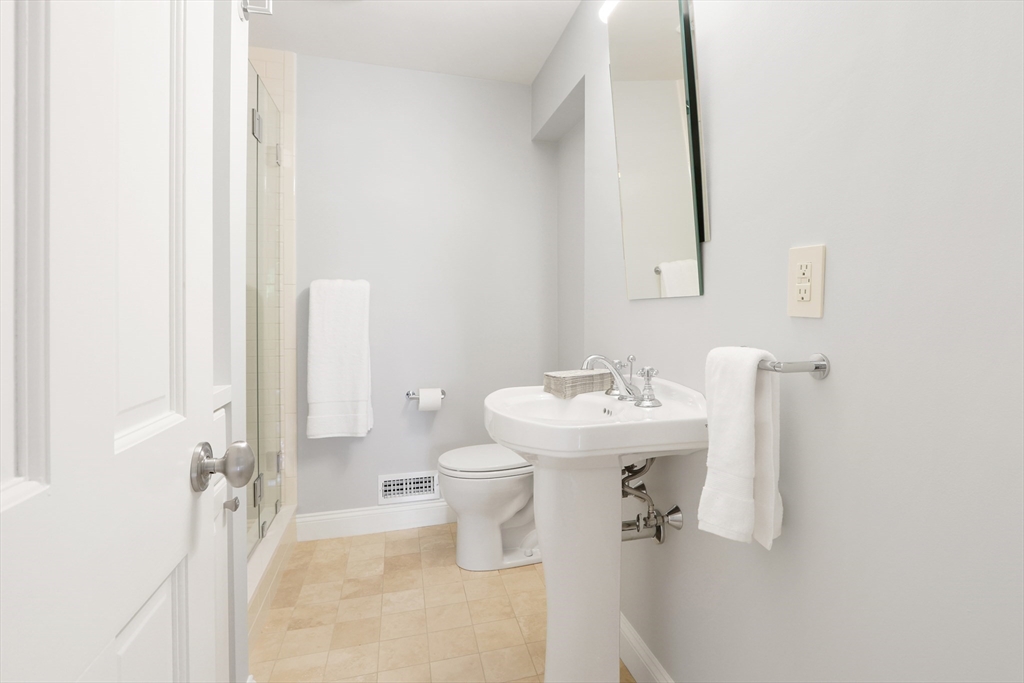 66 Avalon Road Needham, MA 02492 - Photo 15 of 39 a bathroom with a sink toilet and shower