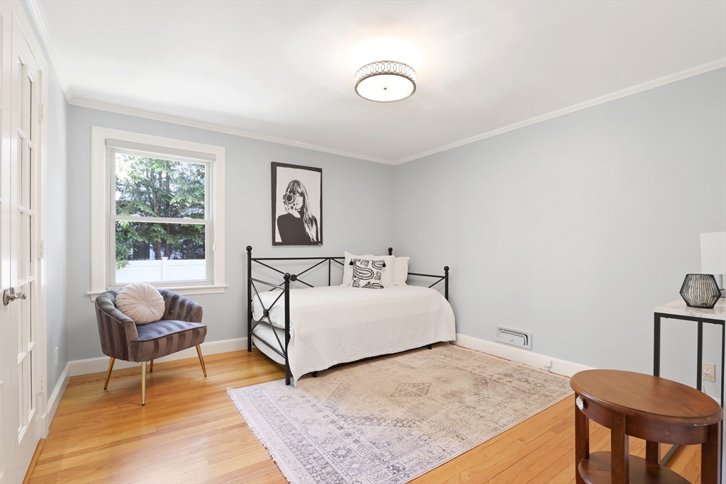 66 Avalon Road Needham, MA 02492 - Photo 17 of 39 a bed room with a bed and a chair