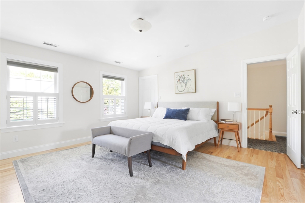 66 Avalon Road Needham, MA 02492 - Photo 21 of 39 a spacious bedroom with a bed and a window