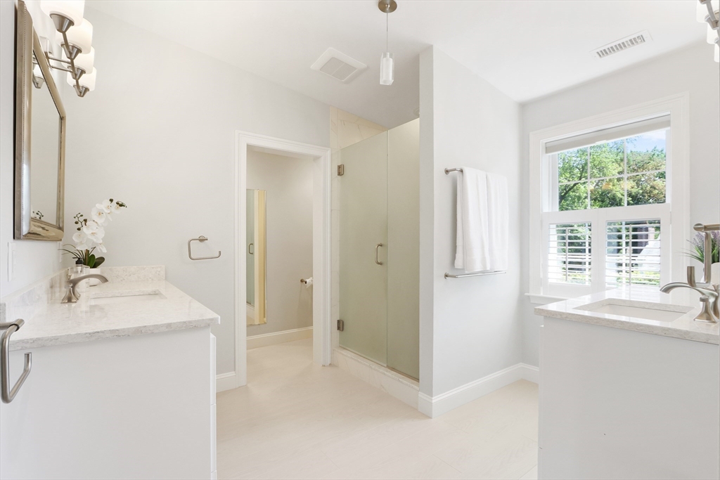 66 Avalon Road Needham, MA 02492 - Photo 24 of 39 a en suite bathroom with a sink a mirror and a shower