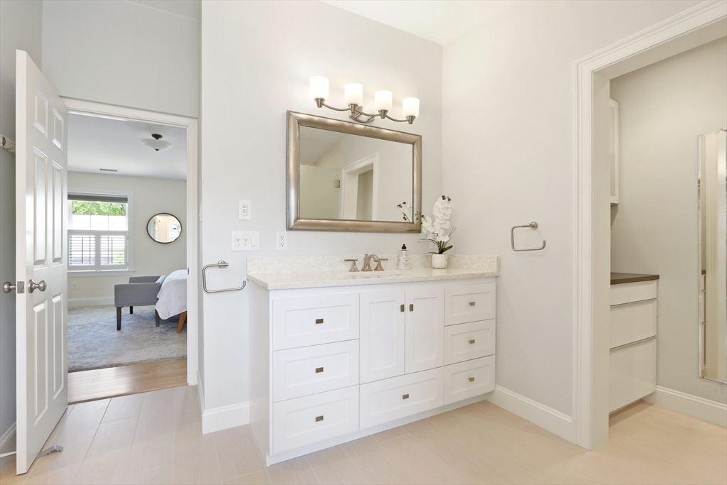 66 Avalon Road Needham, MA 02492 - Photo 25 of 39 a bathroom with double vanity sink a mirror and a vanity