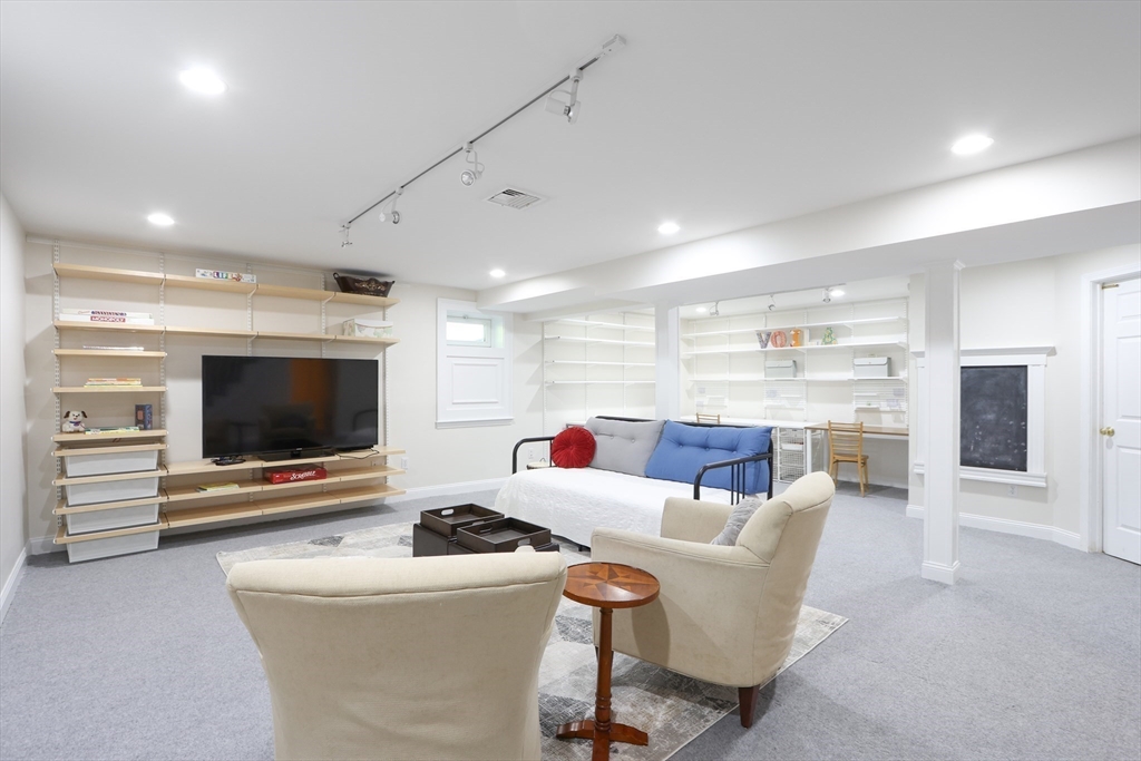 66 Avalon Road Needham, MA 02492 - Photo 33 of 39 a living room with furniture and a flat screen tv