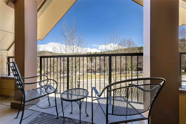 a view of a balcony with furniture