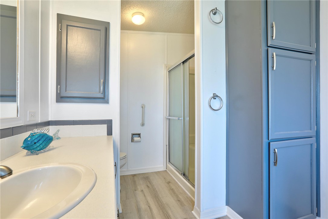 7519 Chasta Road Micco, FL 32976 - Photo 14 of 27 a bathroom with a tub sink and mirror