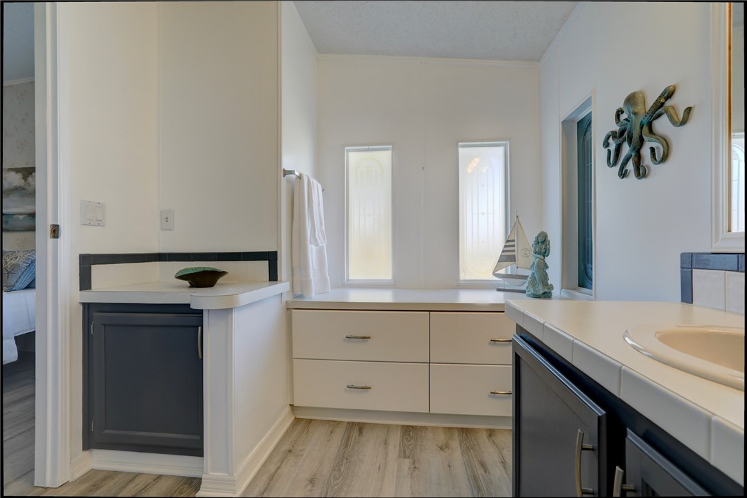 7519 Chasta Road Micco, FL 32976 - Photo 15 of 27 a bathroom with a sink and a mirror