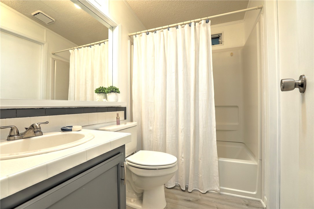 7519 Chasta Road Micco, FL 32976 - Photo 18 of 27 a bathroom with a sink a toilet and shower