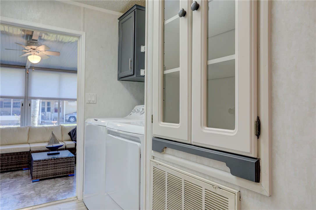 7519 Chasta Road Micco, FL 32976 - Photo 19 of 27 a utility room with dryer and washer