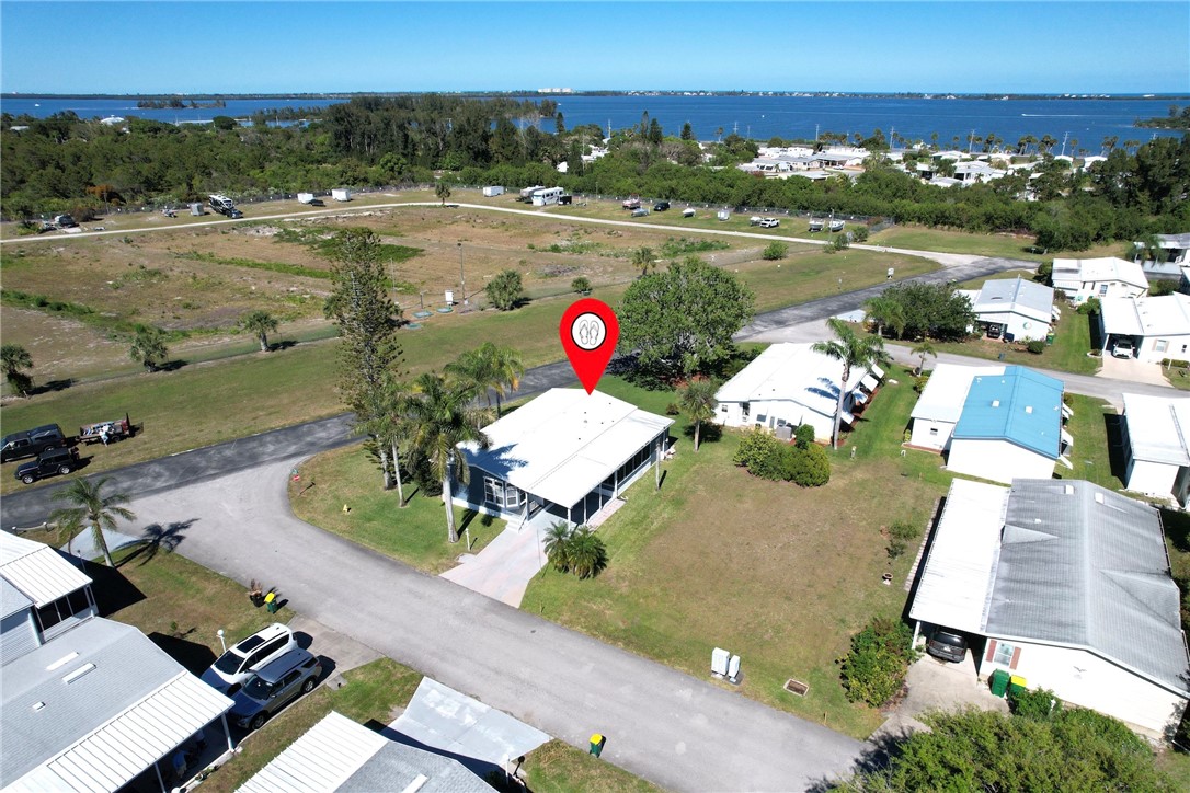 7519 Chasta Road Micco, FL 32976 - Photo 22 of 27 an aerial view of a house with a swimming pool and outdoor space