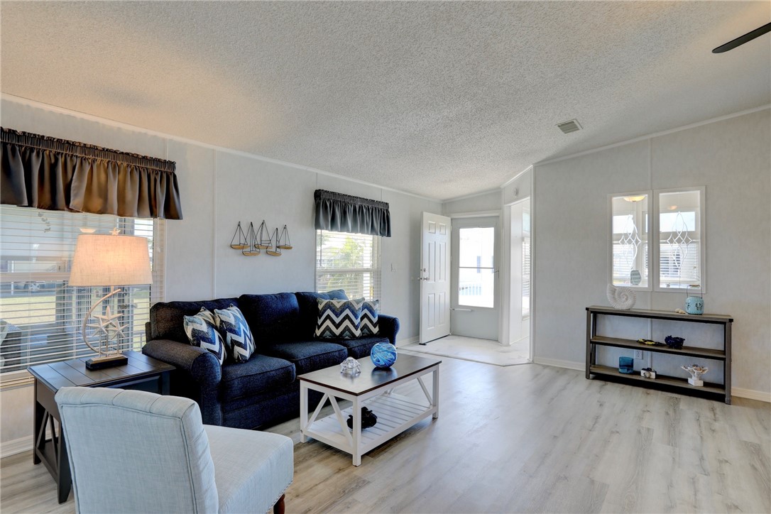 7519 Chasta Road Micco, FL 32976 - Photo 6 of 27 a living room with furniture and a window
