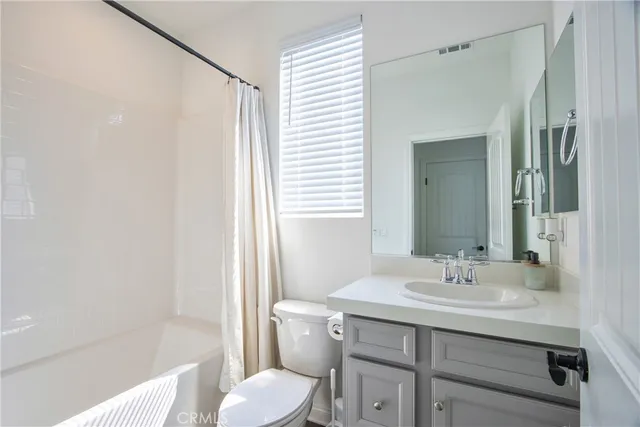 a view of a hallway with windows