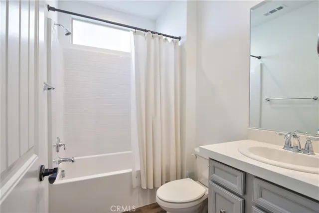 a view of a hallway to rooms