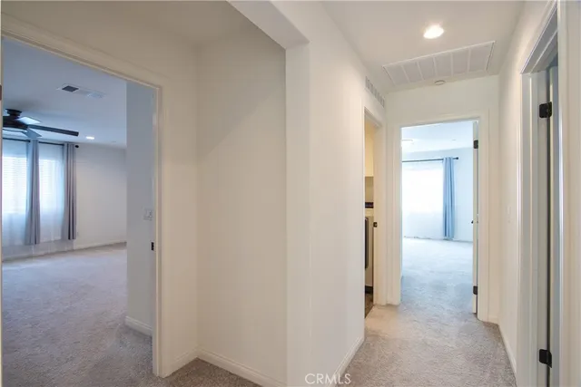 a view of bathroom with a sink and mirror