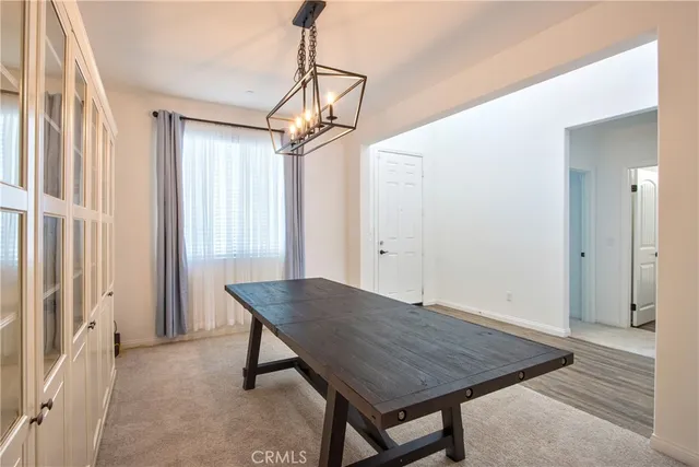 a view of a livingroom with furniture stairs and a ceiling fan