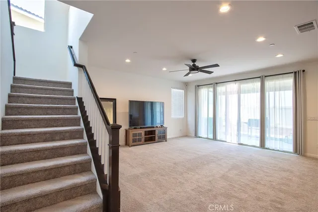 a large kitchen with stainless steel appliances granite countertop a lot of counter space and a sink