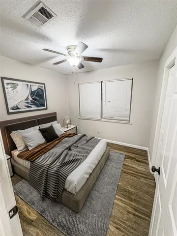 a bedroom with bed and window