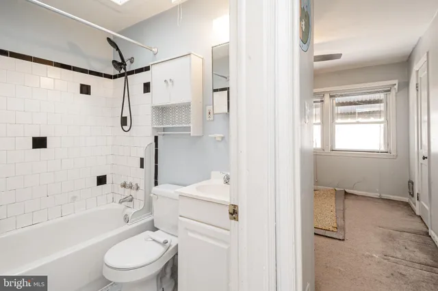 a bathroom with a toilet sink and bathtub