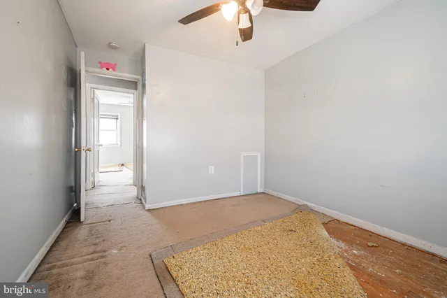 an empty room with a bathroom