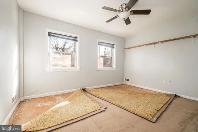 a view of room with hardwood floor and window