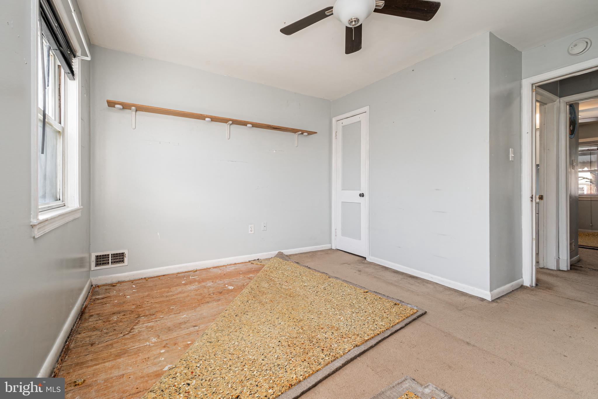 1217 Anglesea Street Baltimore, MD 21224 - Photo 17 of 25 an empty room with a empty space and windows