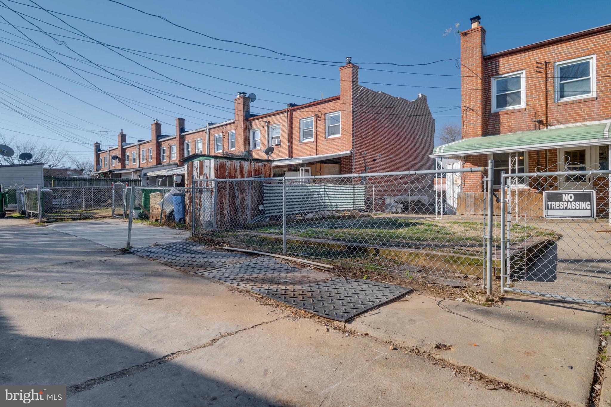 1217 Anglesea Street Baltimore, MD 21224 - Photo 25 of 25 a front view of a house with a yard