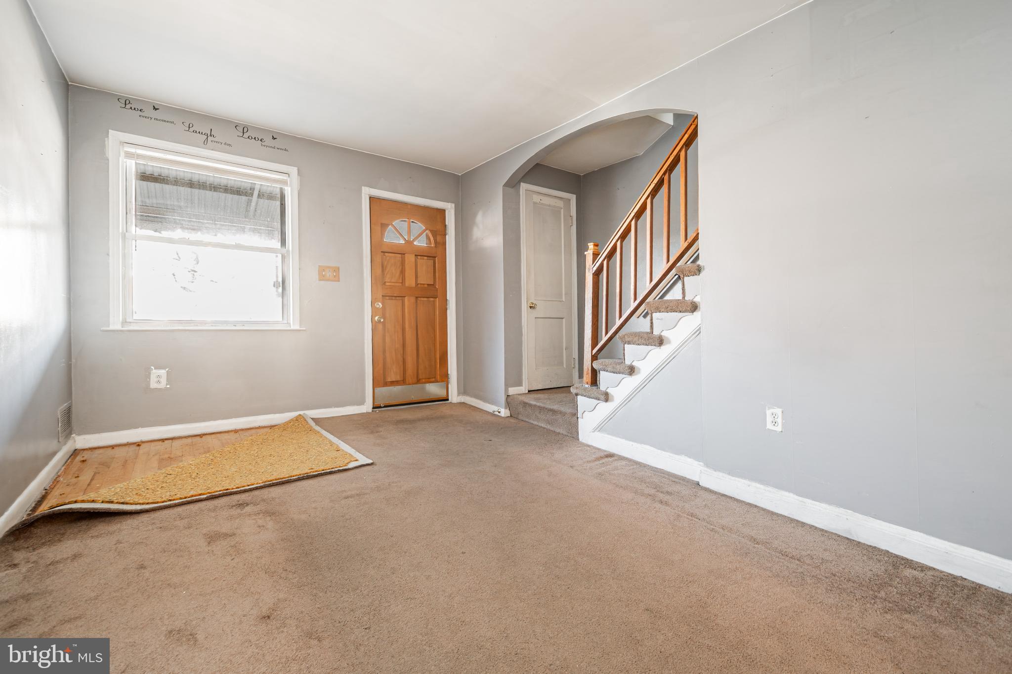 1217 Anglesea Street Baltimore, MD 21224 - Photo 4 of 25 an empty room with windows