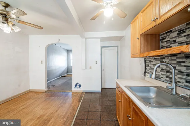 a kitchen with stainless steel appliances granite countertop a sink and a stove
