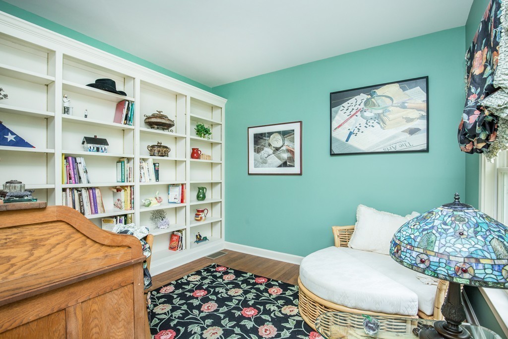 12 Dana Road Boxford, MA 01921 - Photo 12 of 26 a living room with furniture and a book shelf