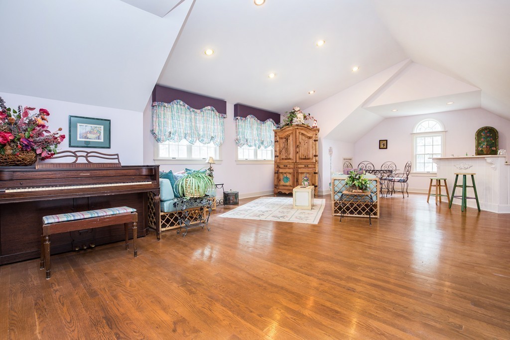 12 Dana Road Boxford, MA 01921 - Photo 20 of 26 a living room with furniture a dining table and a potted plant