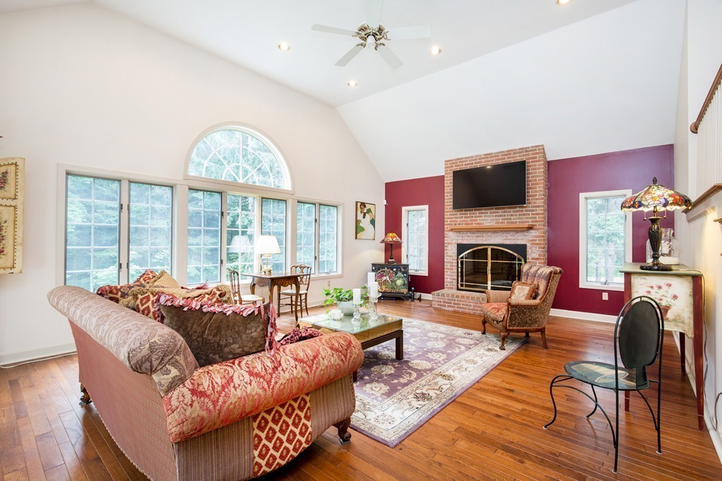 12 Dana Road Boxford, MA 01921 - Photo 8 of 26 a living room with fireplace furniture and a large window