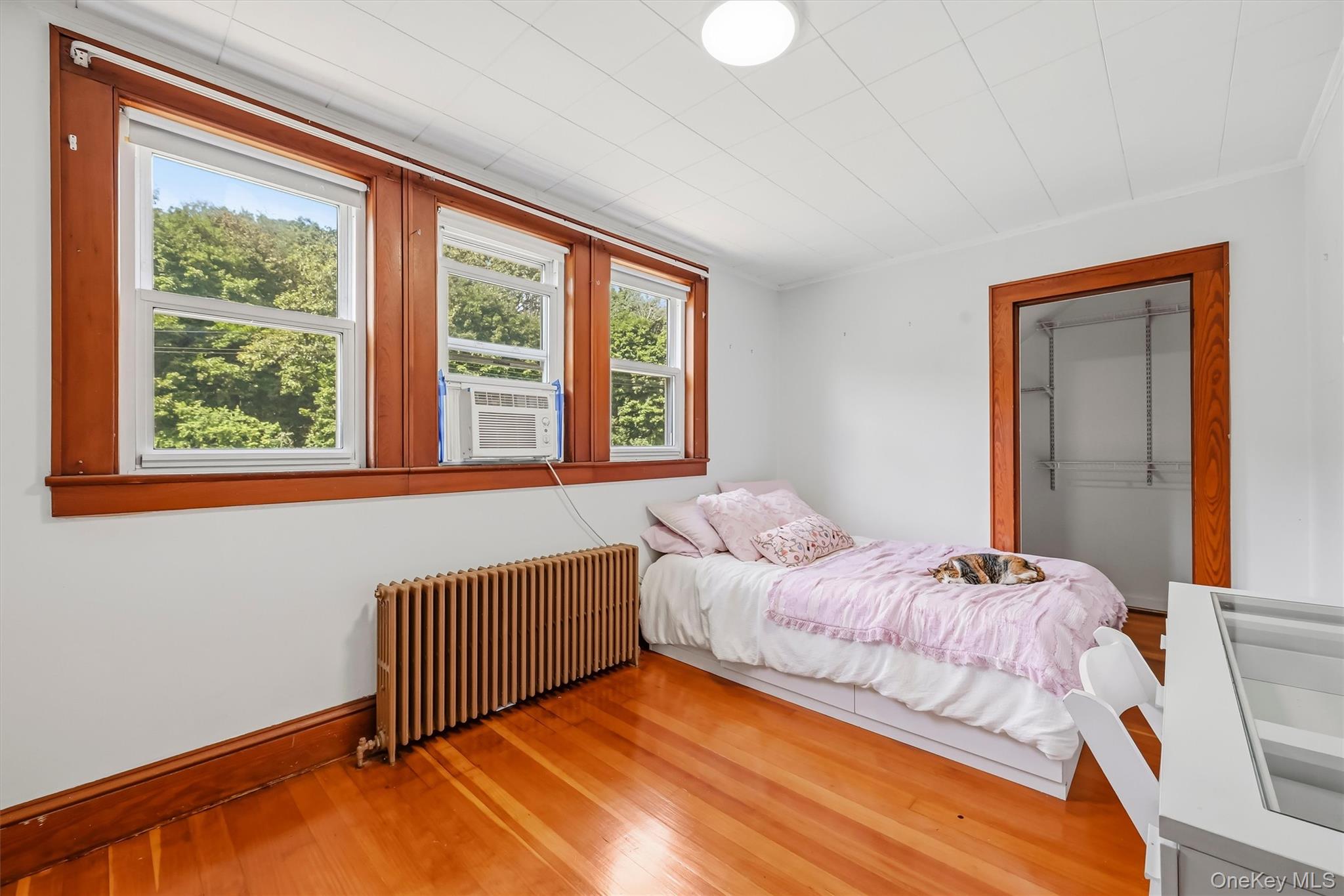 328 Big Island Road Florida, NY 10921 - Photo 20 of 40 Bedroom with hardwood floors, three windows and generous closet space.