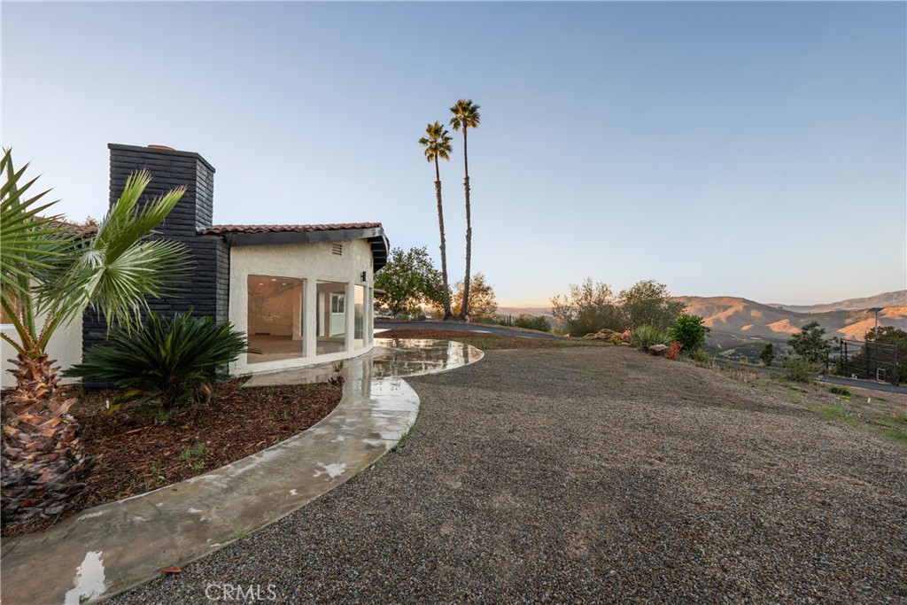 32336 Cole Grade Road Valley Center, CA 92082 - Photo 22 of 28 a view of a house with backyard and plants