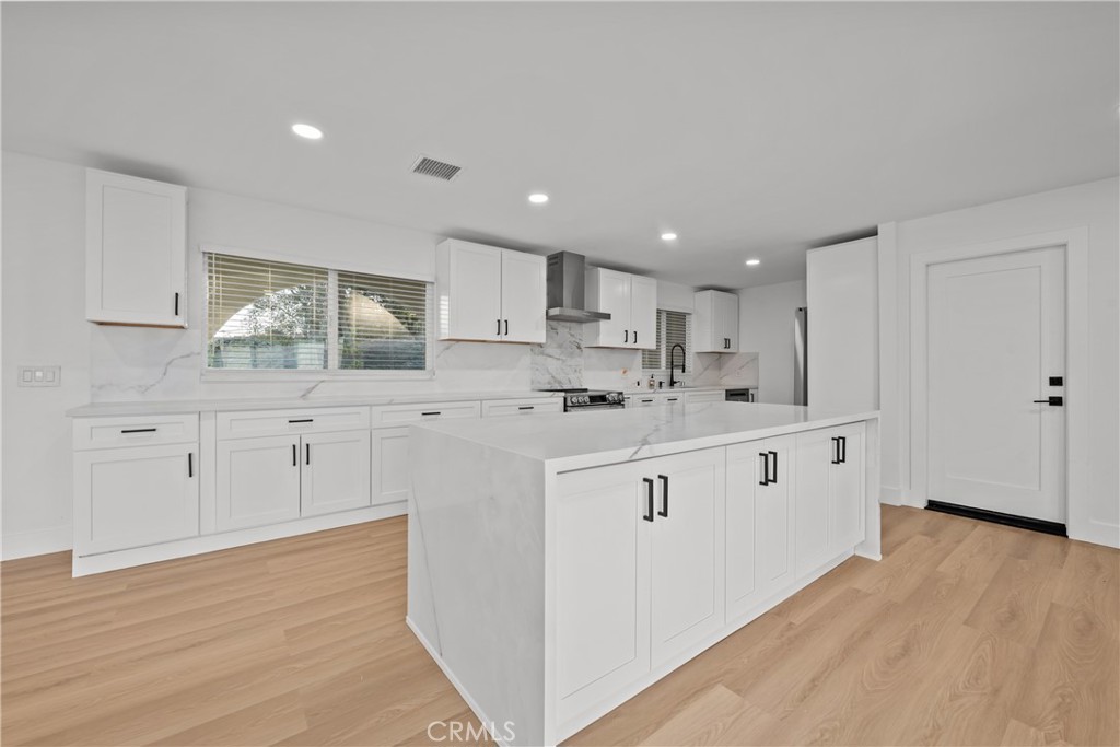 32336 Cole Grade Road Valley Center, CA 92082 - Photo 7 of 28 a kitchen with white cabinets white appliances and sink