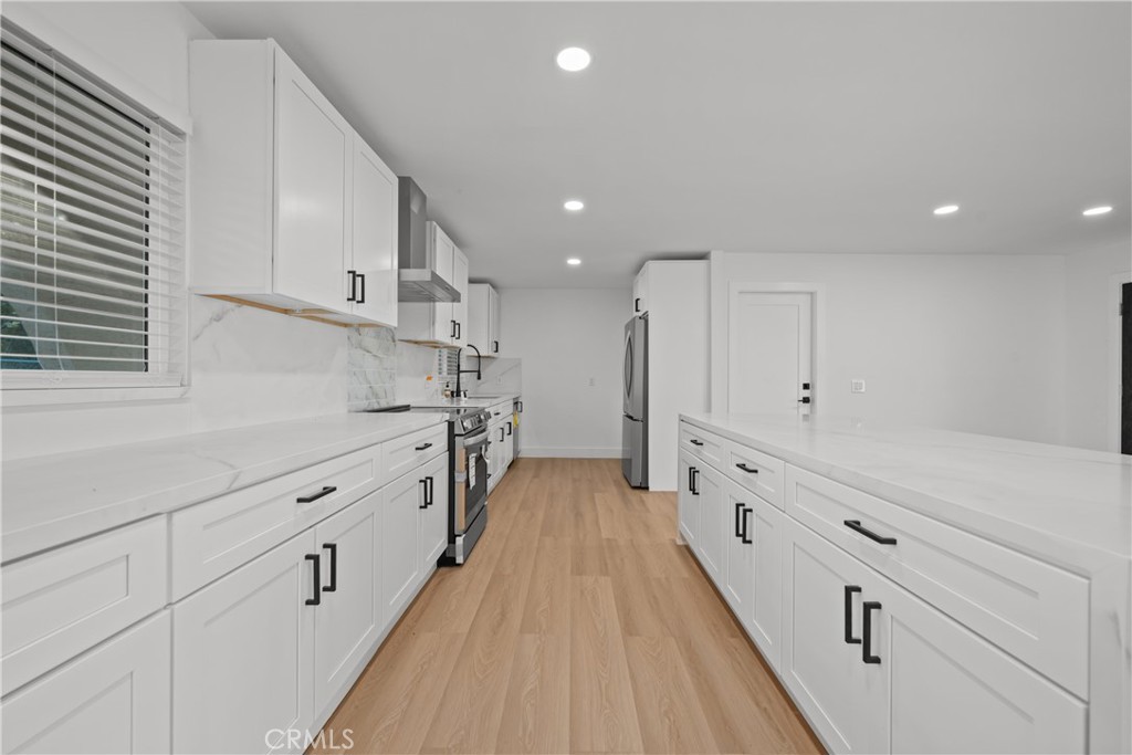 32336 Cole Grade Road Valley Center, CA 92082 - Photo 8 of 28 a kitchen with granite countertop white cabinets and stainless steel appliances