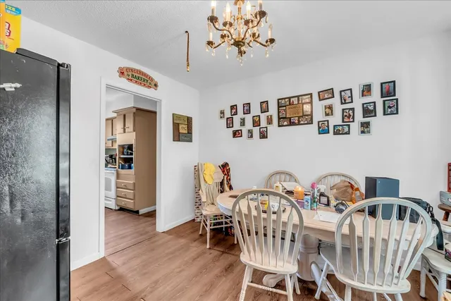 a bathroom with a granite countertop double vanity sink and a mirror