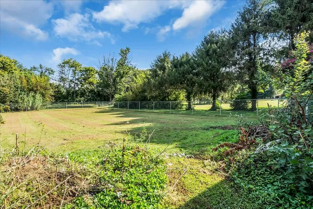 a view of living room kitchen and stainless steel appliances