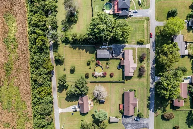 an aerial view of residential houses with outdoor space