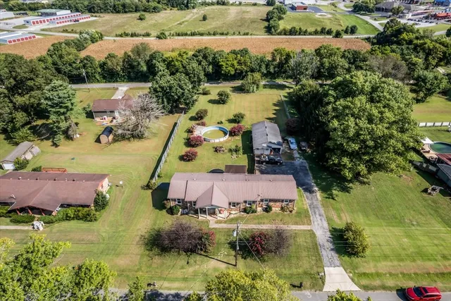 an aerial view of house with a yard