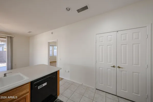 a view of a kitchen from the hallway