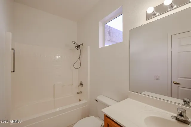 a view of a bathroom with mirror