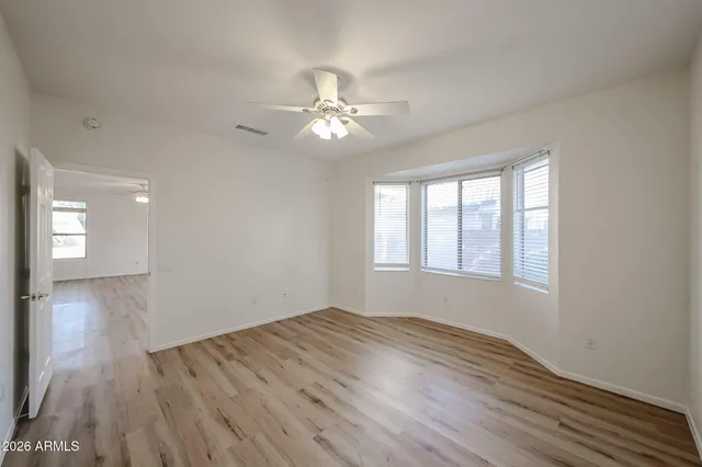 a spacious bathroom with a double vanity sink and a mirror