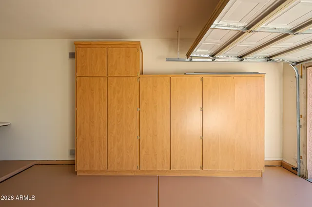 a view of a lake with boats and trees in the background