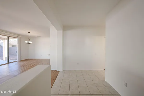 an empty room with wooden floor