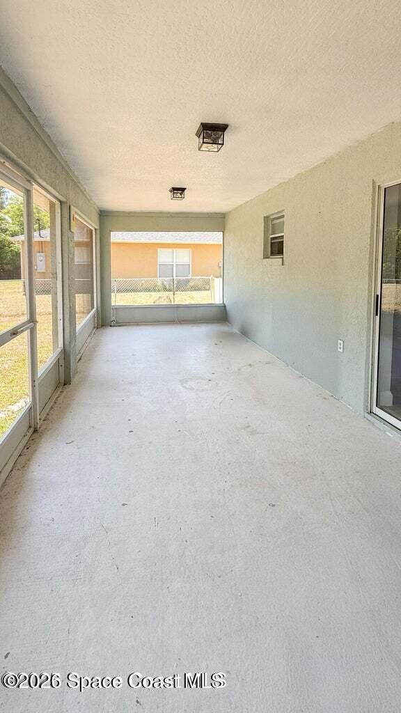 544 Plumbago Road Northwest Palm Bay, FL 32907 - Photo 14 of 14 a view of an empty room with a window